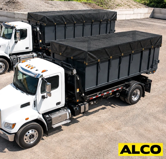 A heavy-duty tarp cover fitted over an open-top dumpster to contain waste and debris.