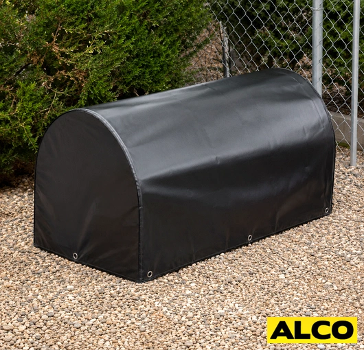 Outdoor waterproof storage cover protecting equipment or materials stored outside at an industrial or commercial facility.