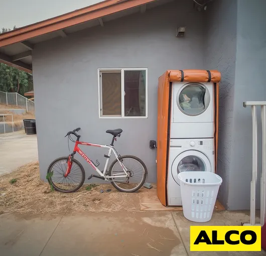 Front load washer dryer outdoor enclosure roll up door