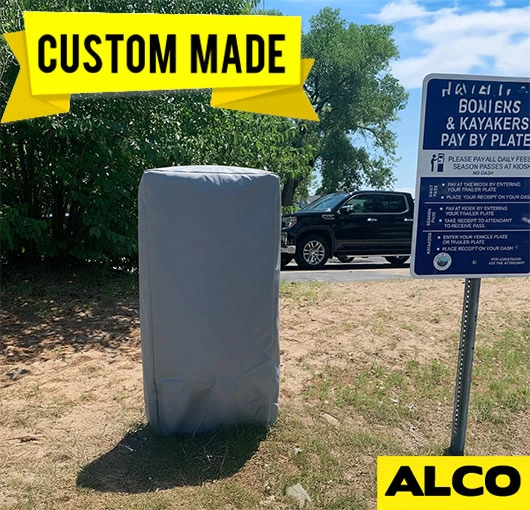 Outdoor custom-fit vinyl cover protects paystation from weather damage