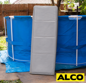 Custom-made all-weather covers fitted over pool ladder rails in an outdoor setting.