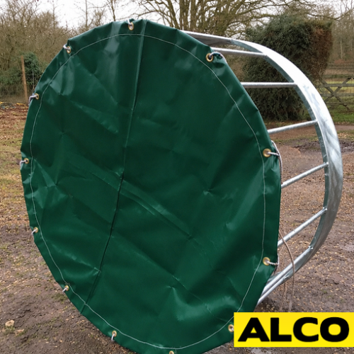 Custom-made outdoor cover fitted over a sheep ring feeder to protect hay and feed from weather.