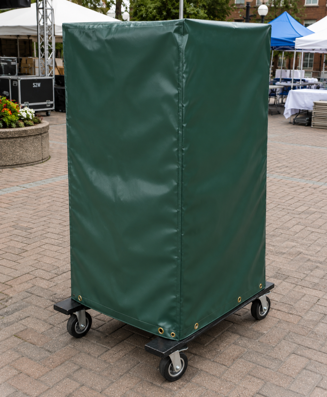 Heavy duty custom covers fitted over outdoor stanchion carts to protect equipment from weather and debris.