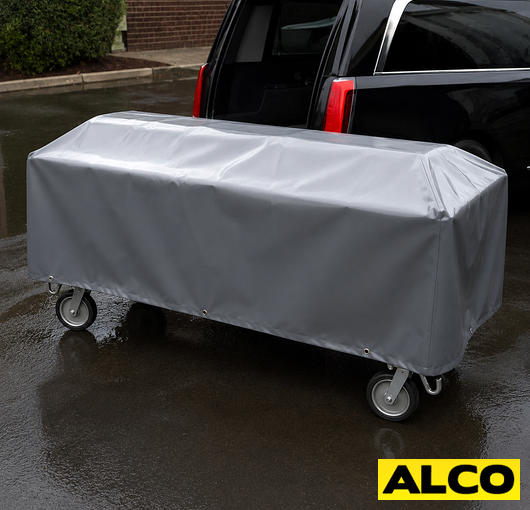 Heavy duty waterproof cover draped over a cadaver cart for mortuary use.
