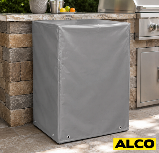 A waterproof cover fitted over an outdoor wine fridge in a patio kitchen setting.