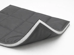 Insulated cover material swatch showing vinyl skins and a single layer of batting