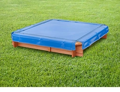 Blue vinyl cover fitted over a wooden sandbox on a lawn